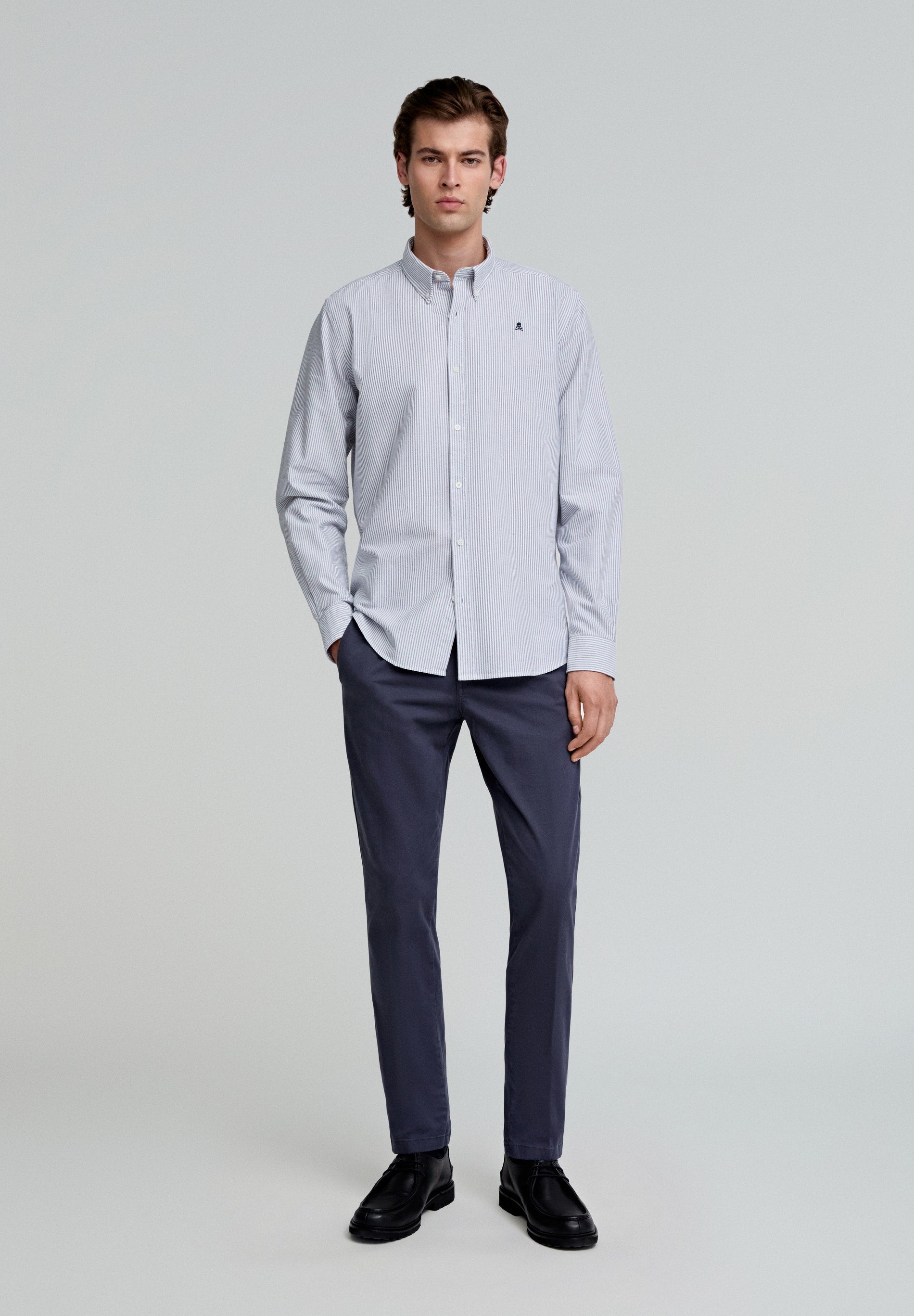 PLEATED CHINO TROUSERS