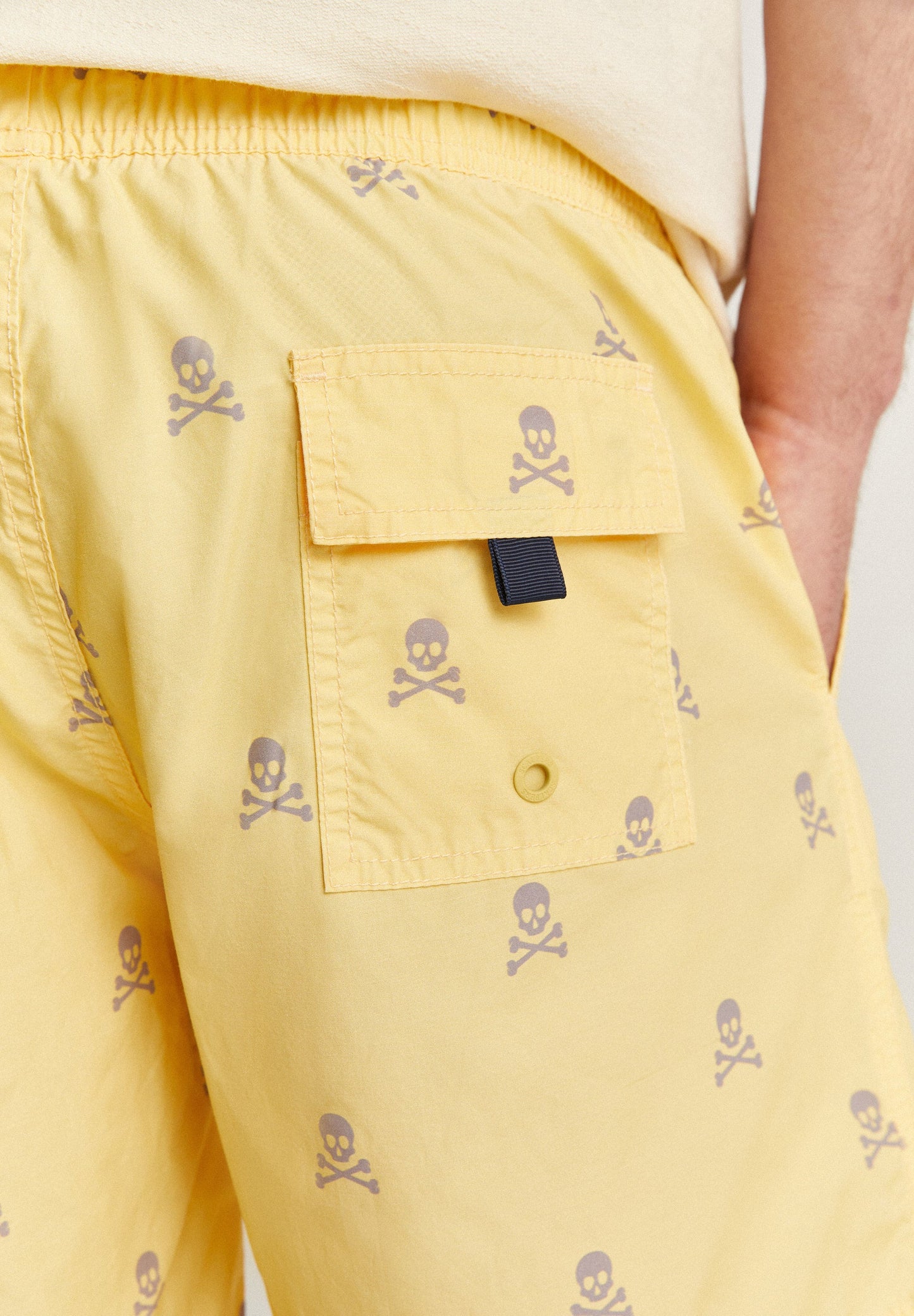 SWIMMING TRUNKS WITH ALL-OVER SKULLS