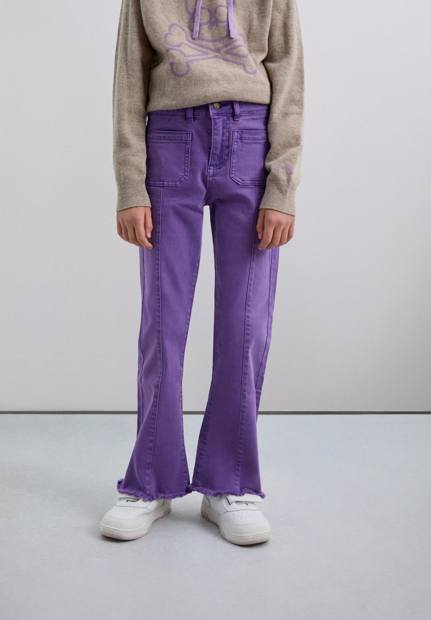 FLARED TROUSERS WITH FRINGING