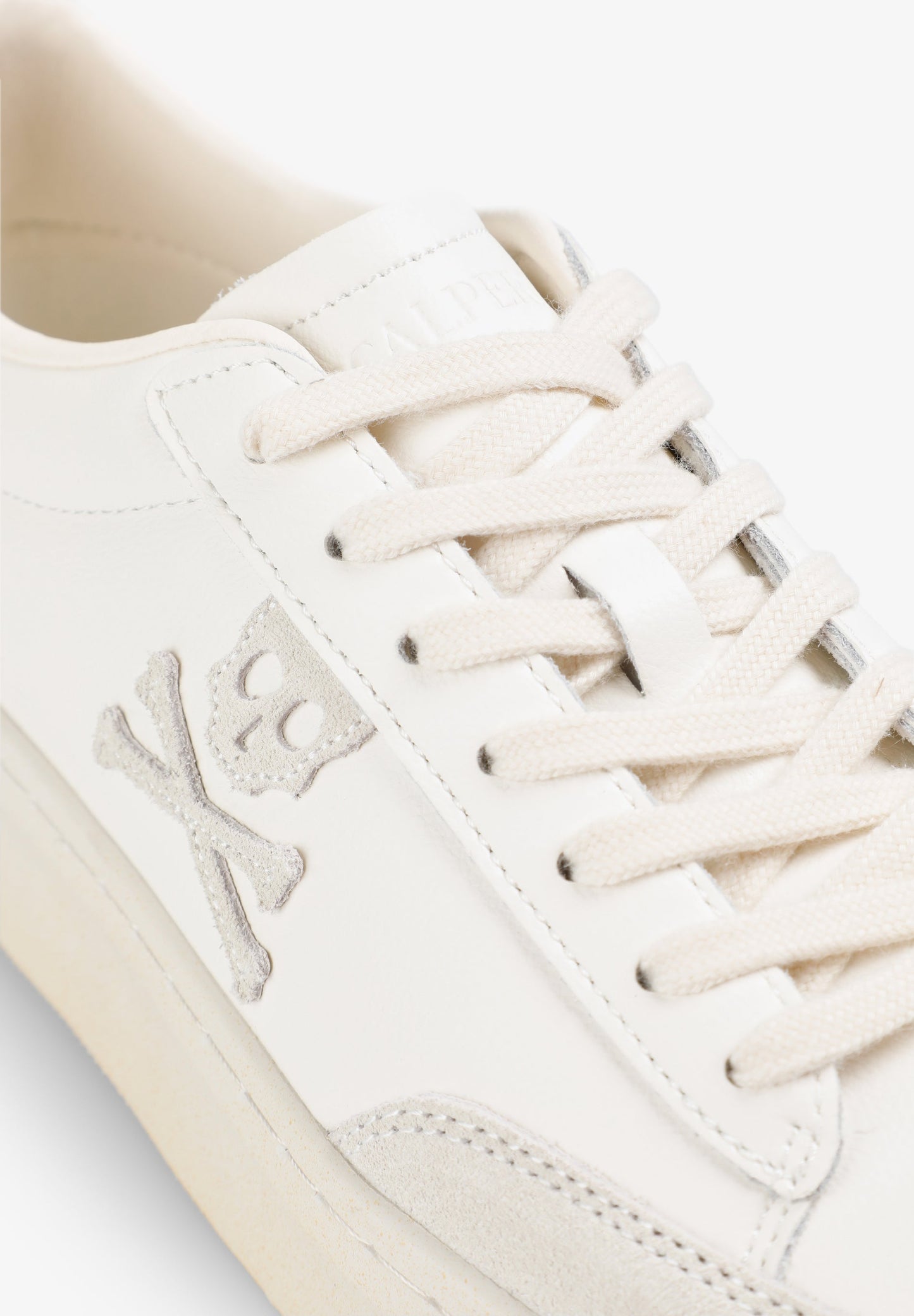 LOW TOP SNEAKERS WITH SIDE SKULL