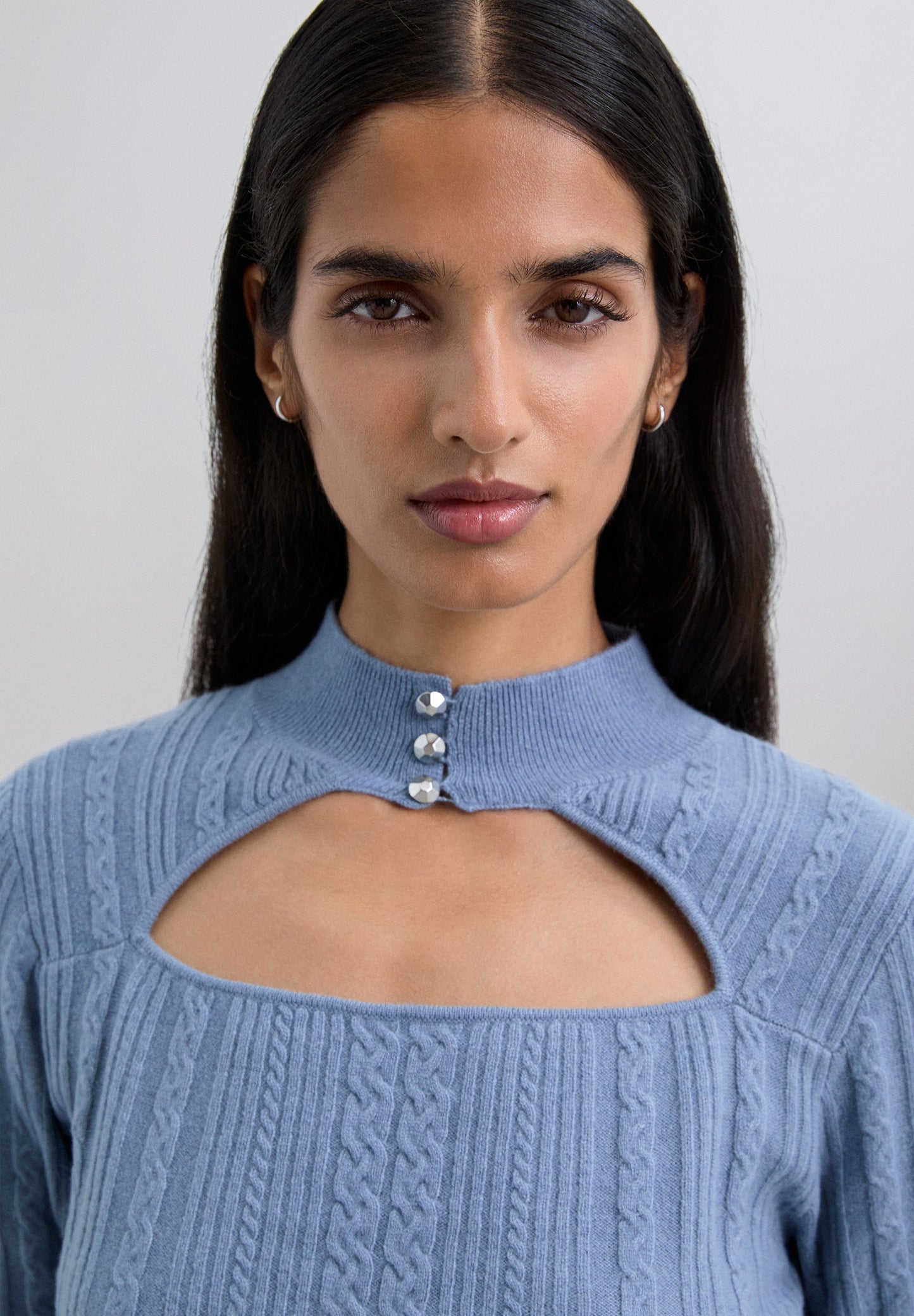 CABLE KNIT SWEATER WITH CUT-OUT