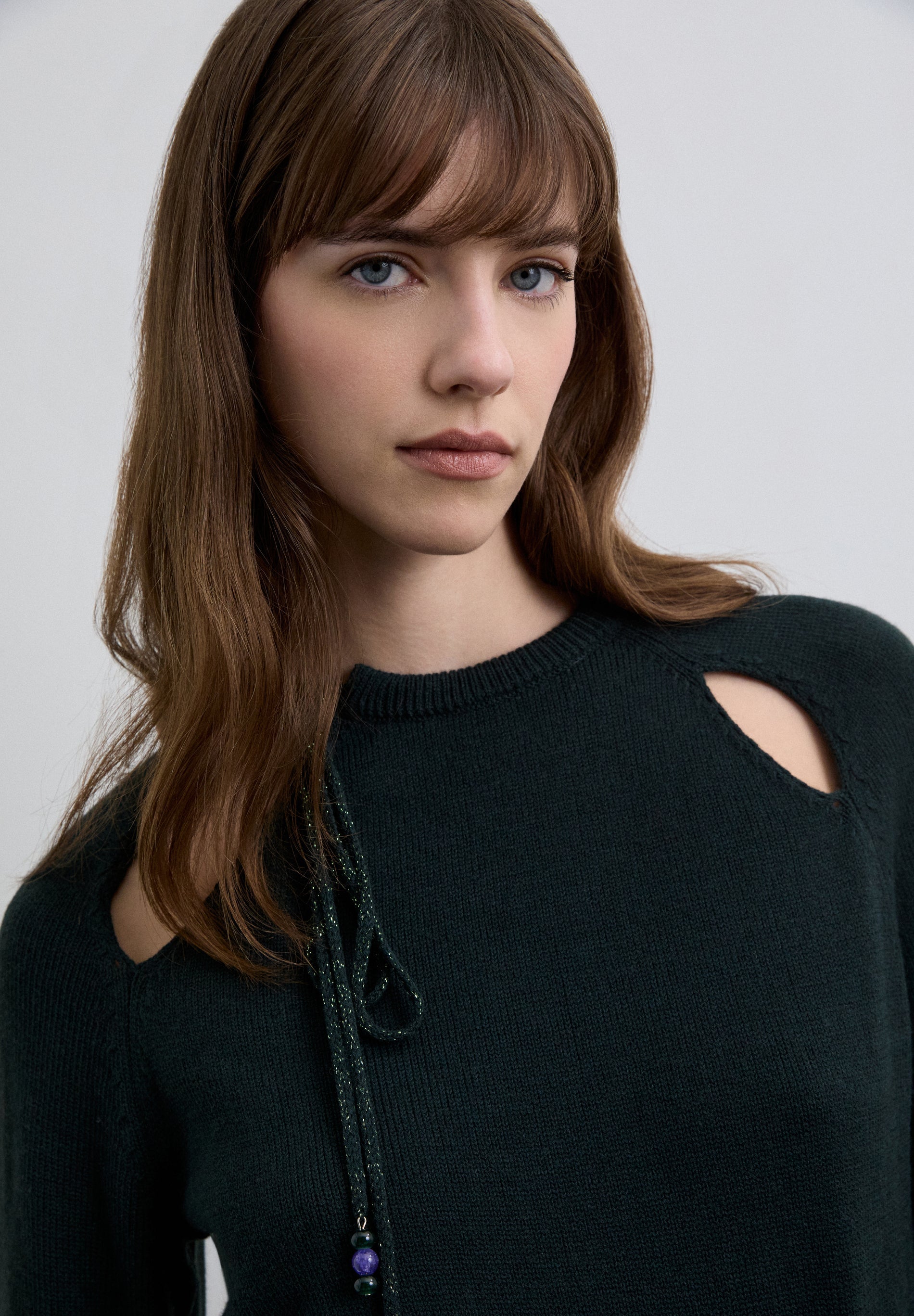 SWEATER WITH CUTOUTS AND TIE DETAIL