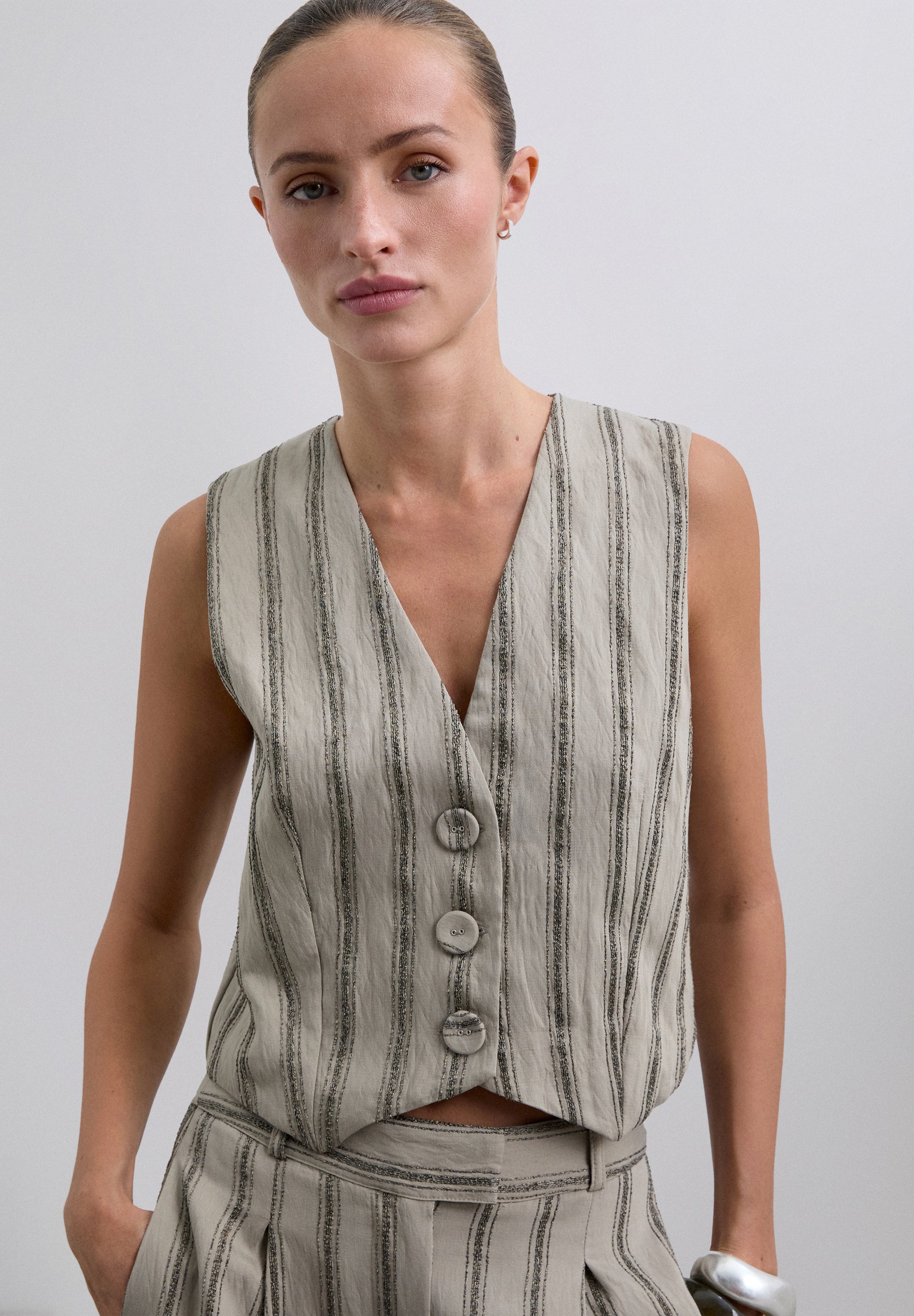 STRIPED WAISTCOAT WITH METALLIC DETAILS