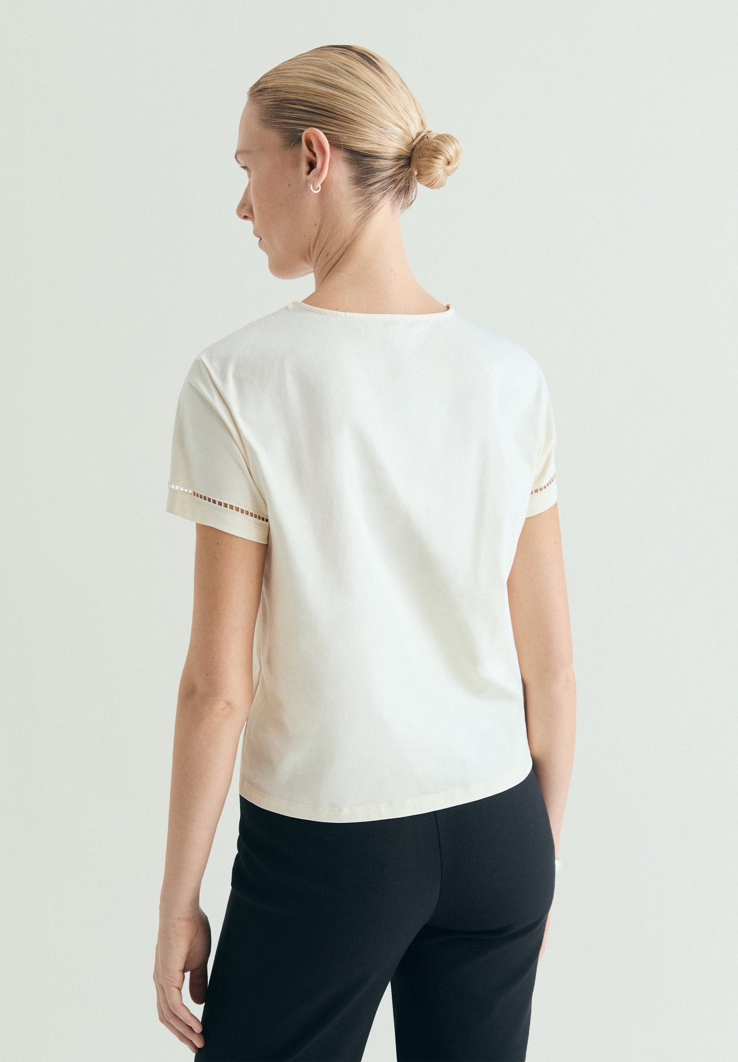 T-SHIRT WITH DIE-CUT STUDDED DETAILS