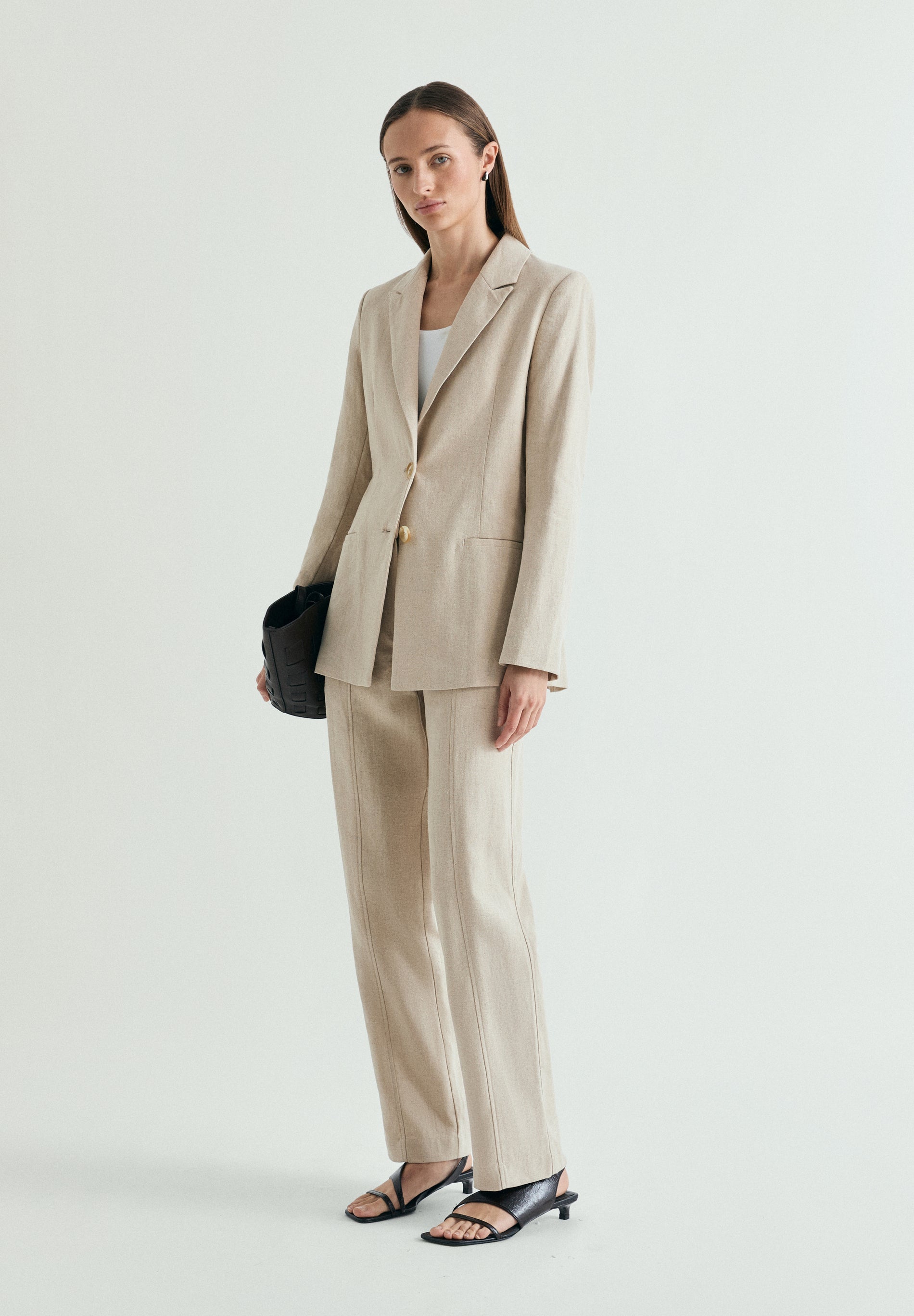 LINEN TROUSERS WITH METAL DETAILS