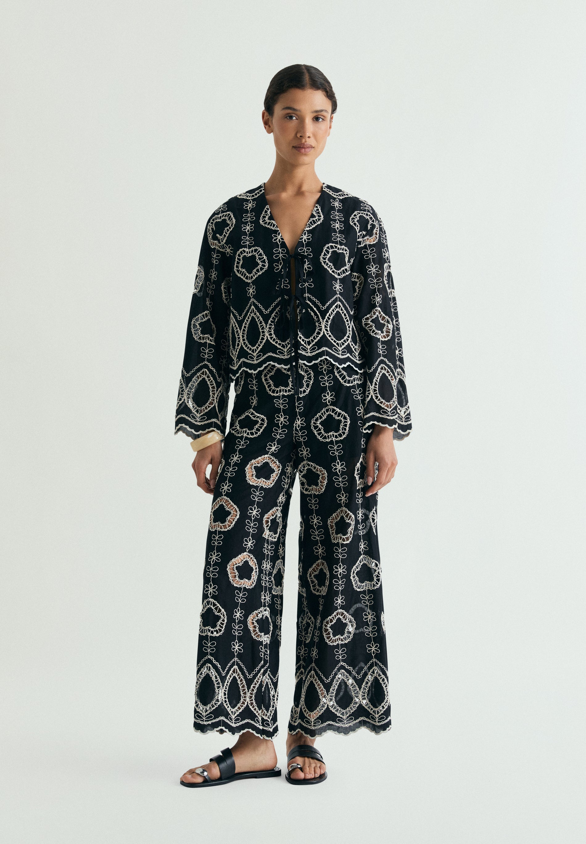 TROUSERS WITH CONTRAST EMBROIDERY