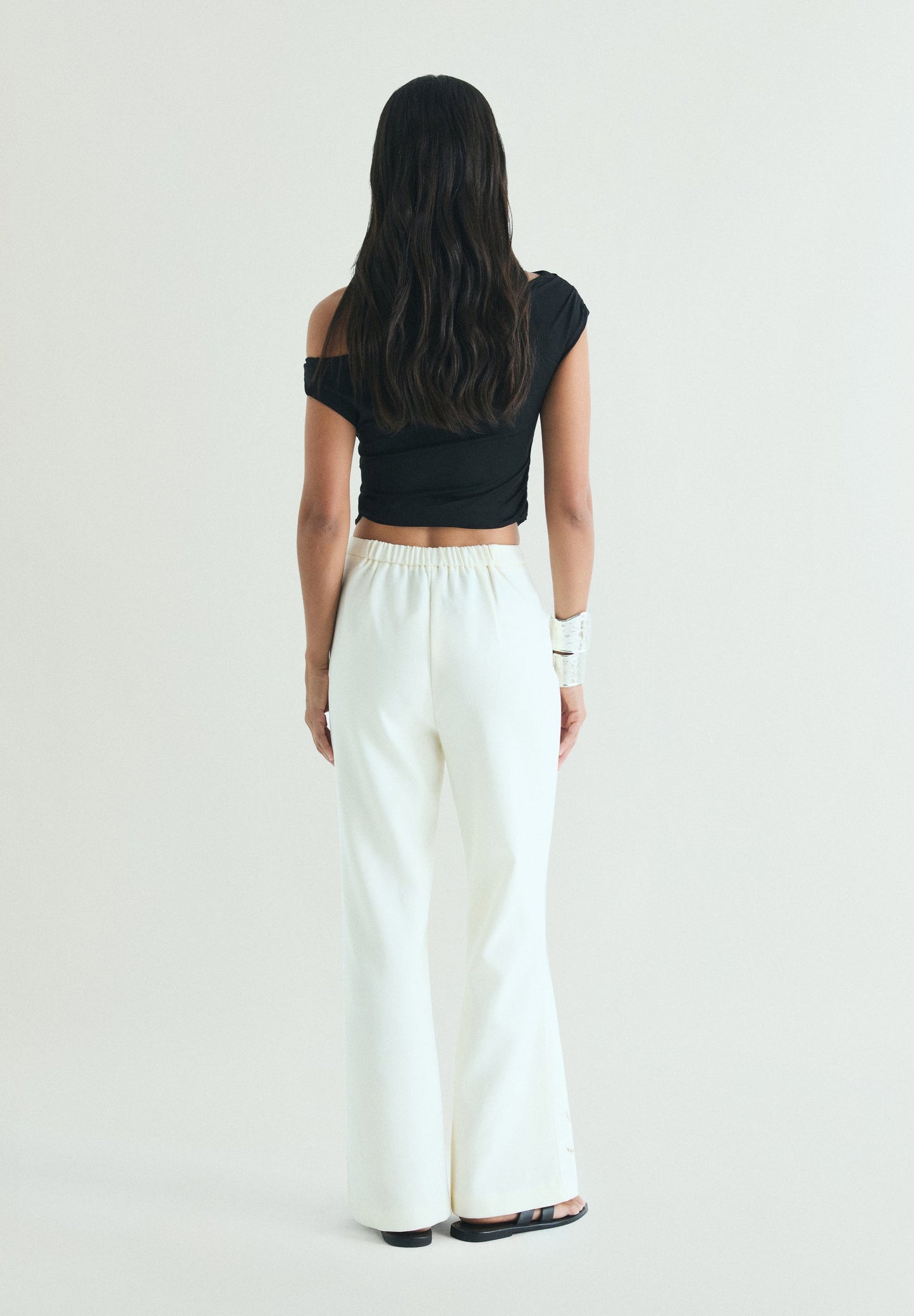 TROUSERS WITH PERFORATED DETAILS