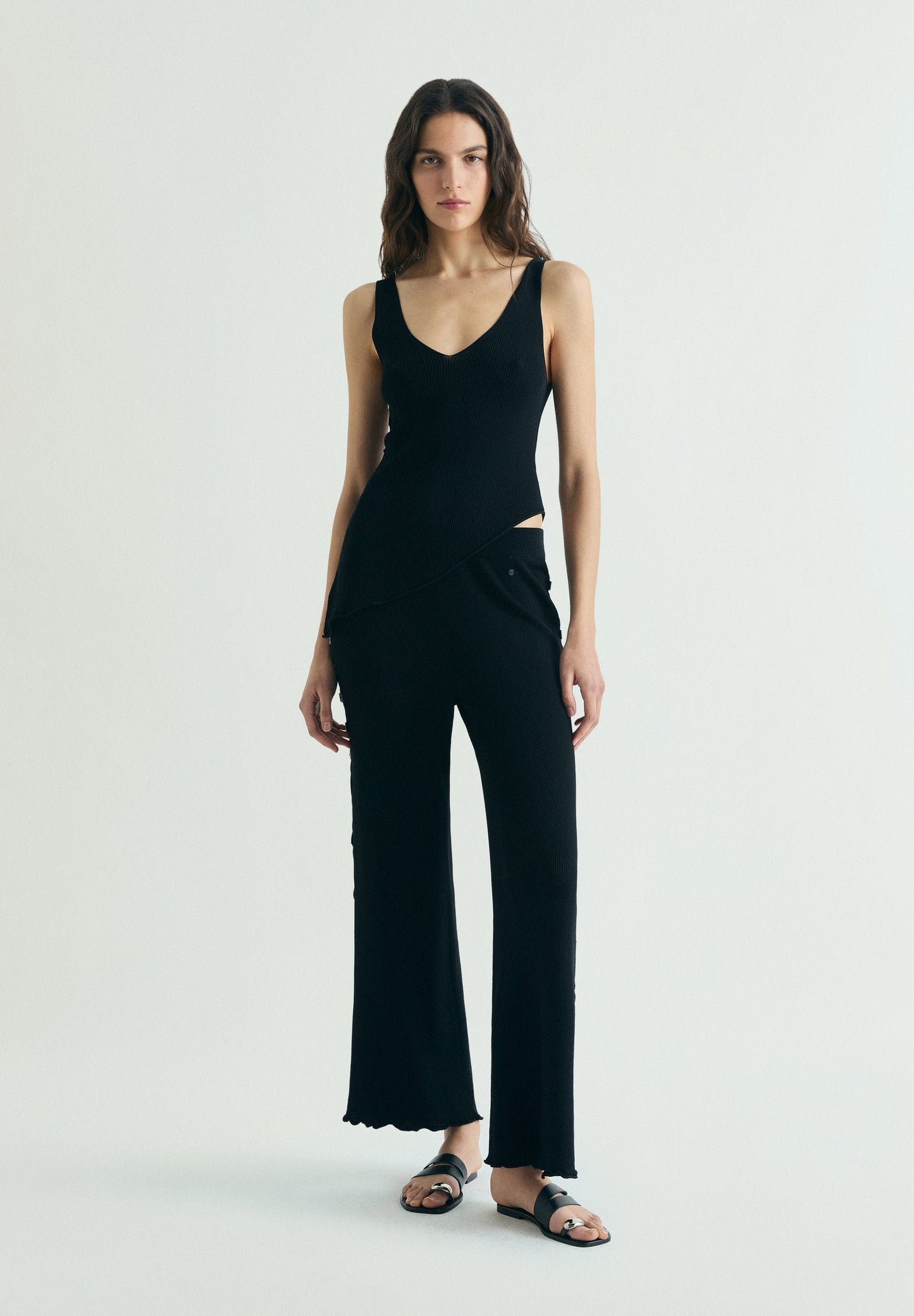 ASYMMETRIC KNIT TOP WITH APPLIQUÉS