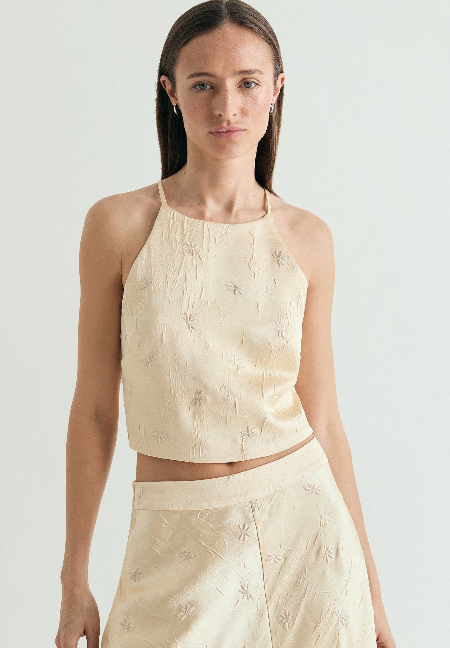 RUFFLED HALTER TOP WITH EMBROIDERY
