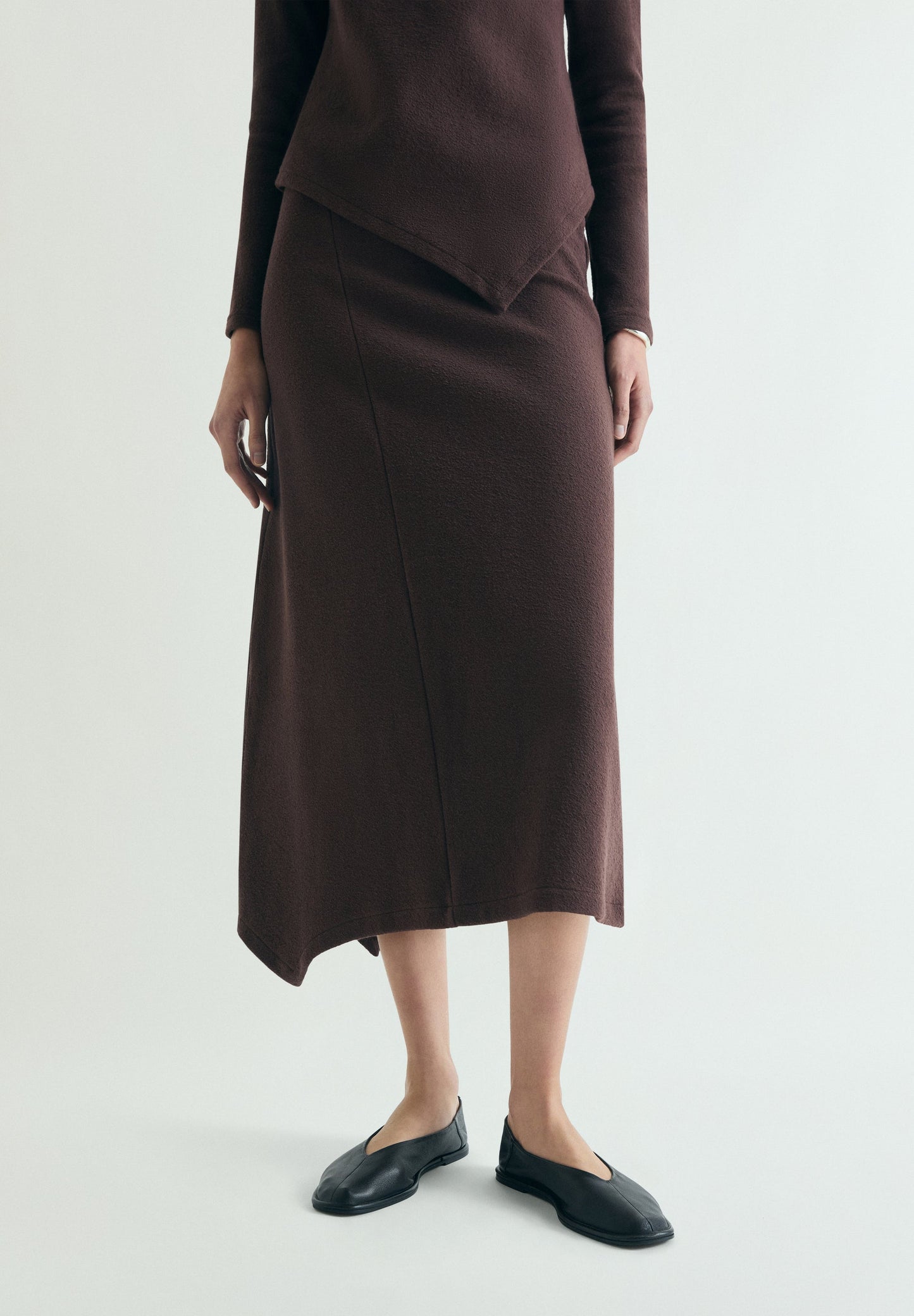 ASYMMETRIC KNIT MIDI SKIRT