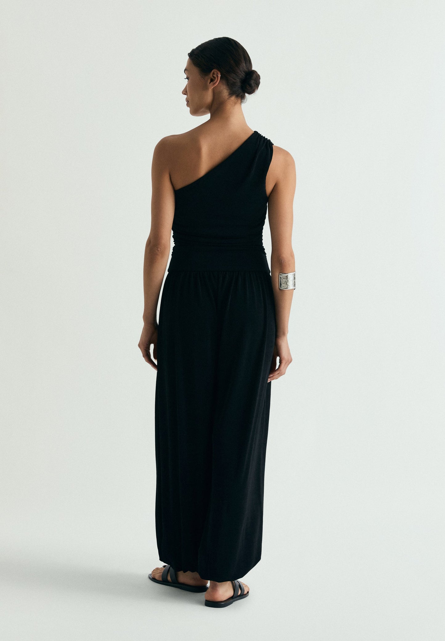 DRAPED ASYMMETRIC JUMPSUIT