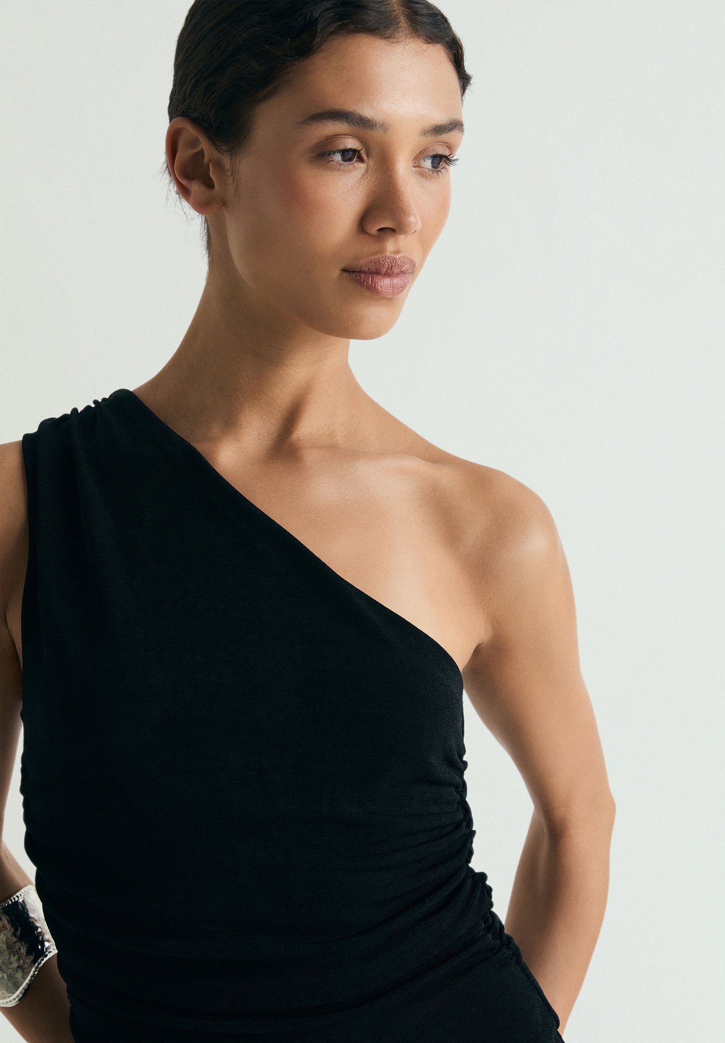 DRAPED ASYMMETRIC JUMPSUIT