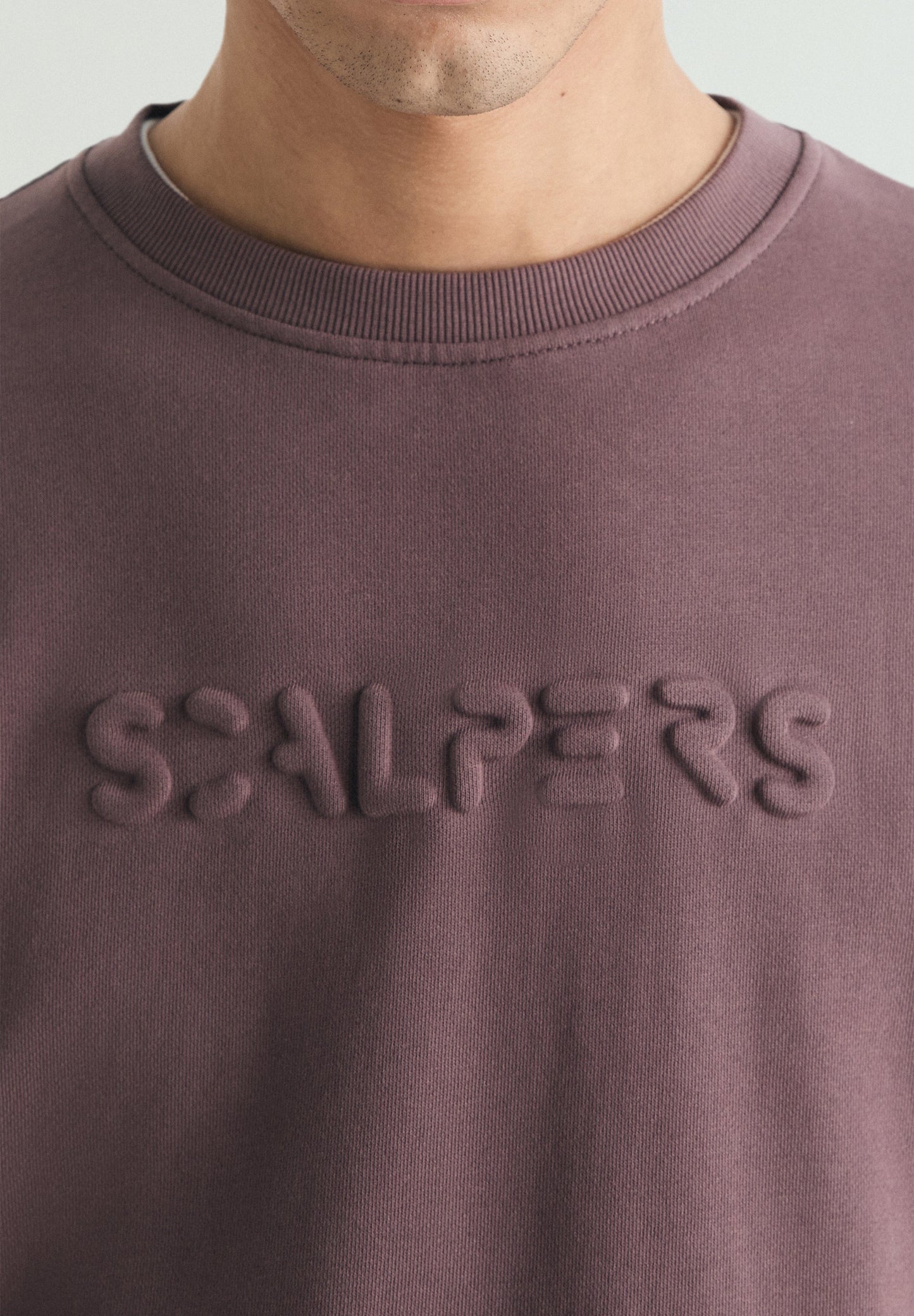 SWEATSHIRT WITH EMBOSSED SKULL