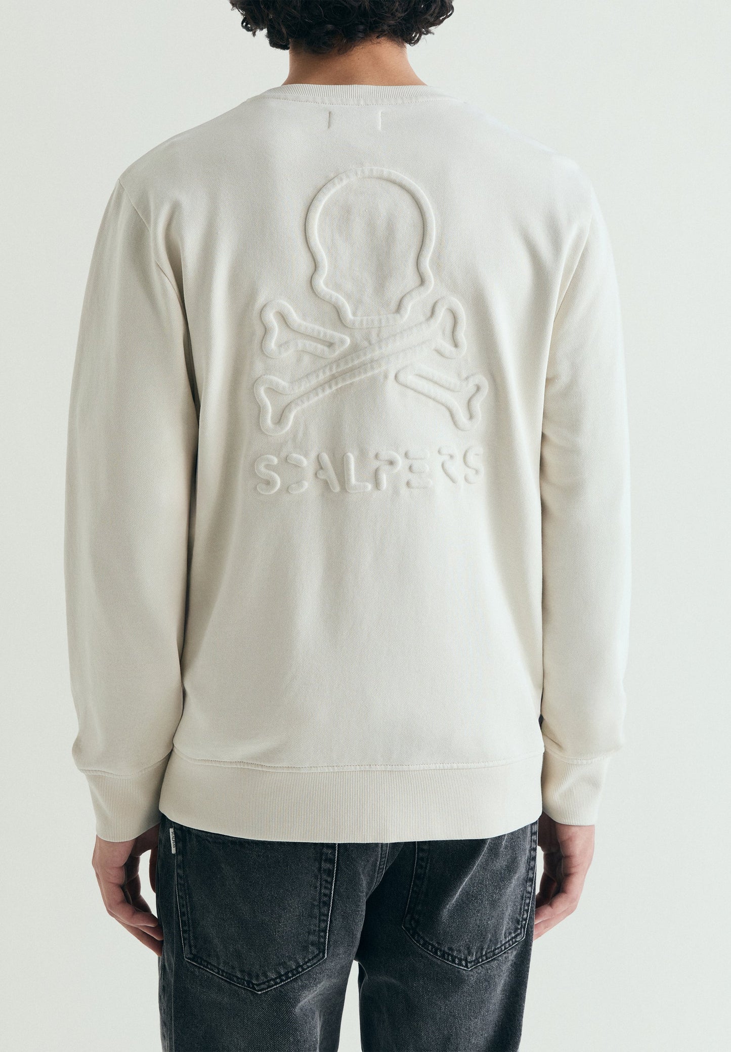 SWEATSHIRT WITH EMBOSSED SKULL