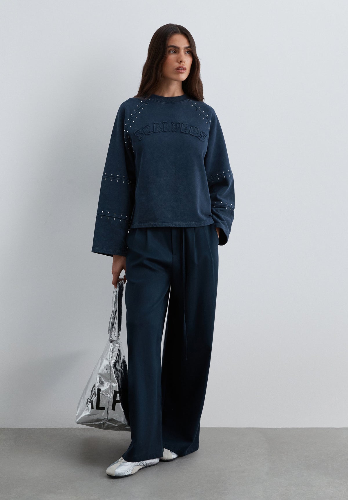 SWEATSHIRT WITH STUDS AND LOGO PATCH