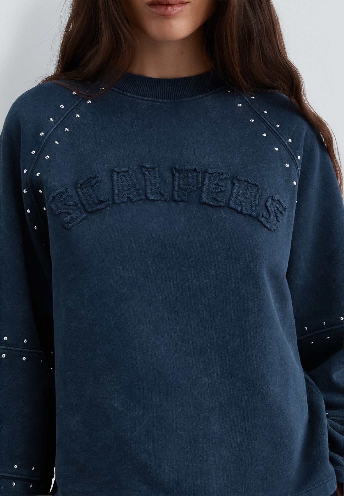 SWEATSHIRT WITH STUDS AND LOGO PATCH
