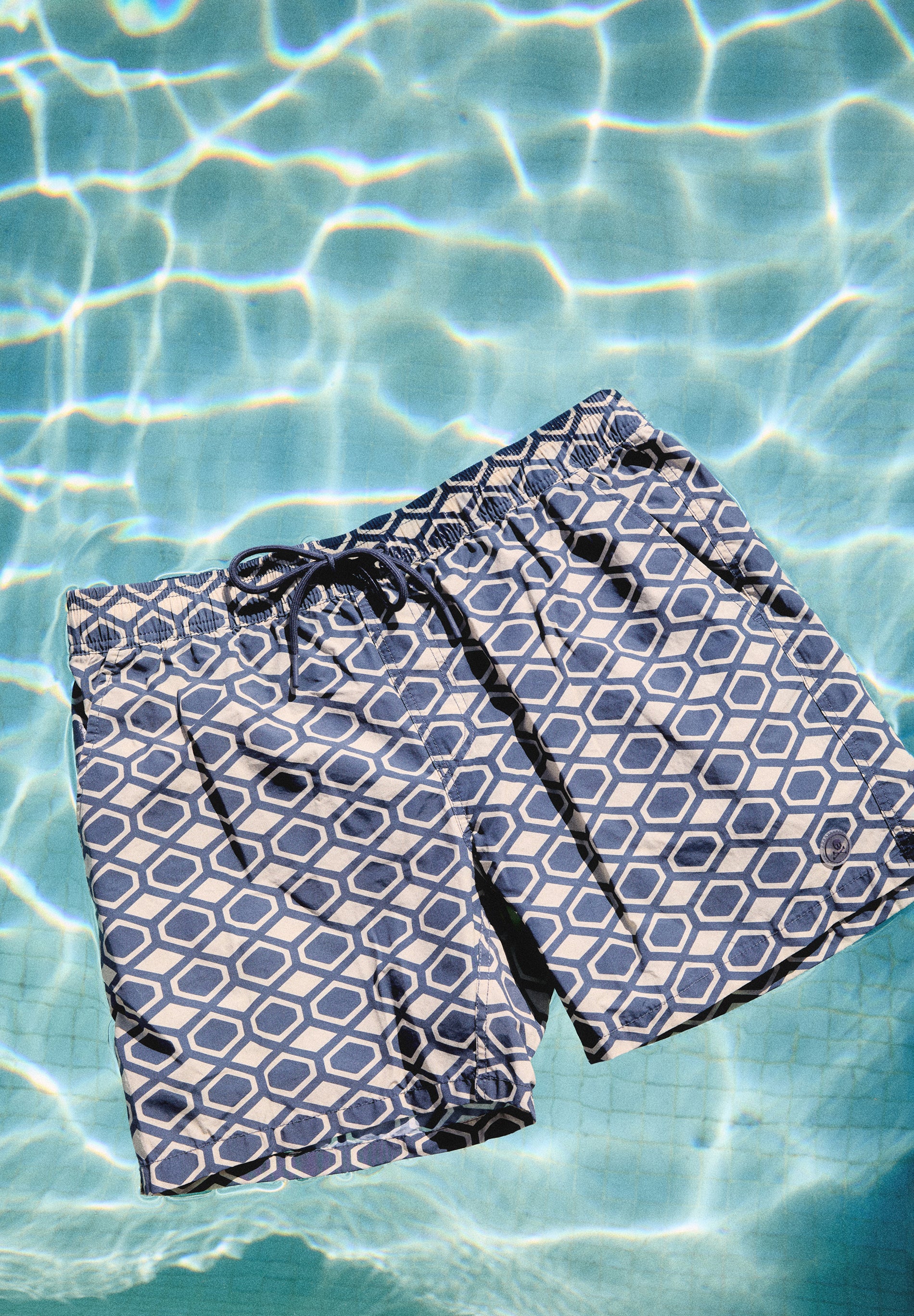 GEOMETRIC PRINT SWIMMING TRUNKS
